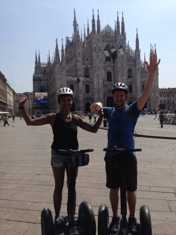 travel couple in Milan segway tour in front of duomo