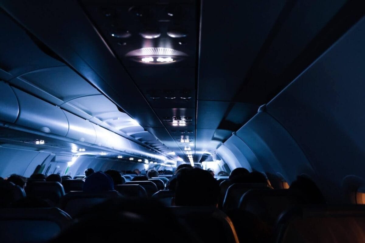 dark airplane cabin during long flight