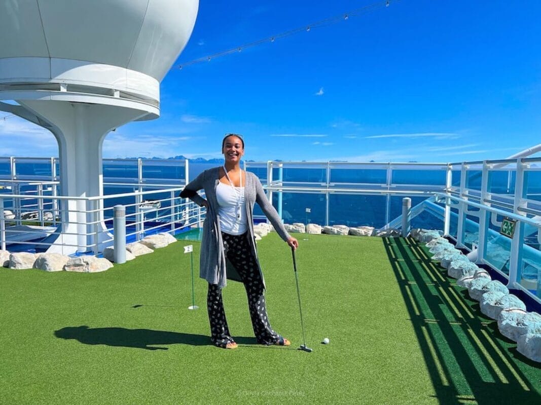 playing mini golf in the middle of the ocean on a cruise ship