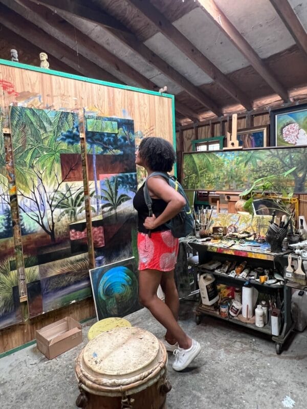 inside an art studio with nature and afro latino paintings