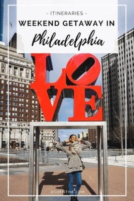 standing under the love statue  sculpture in philadelphia with text overlay that says weekend getaway in Philadelphia