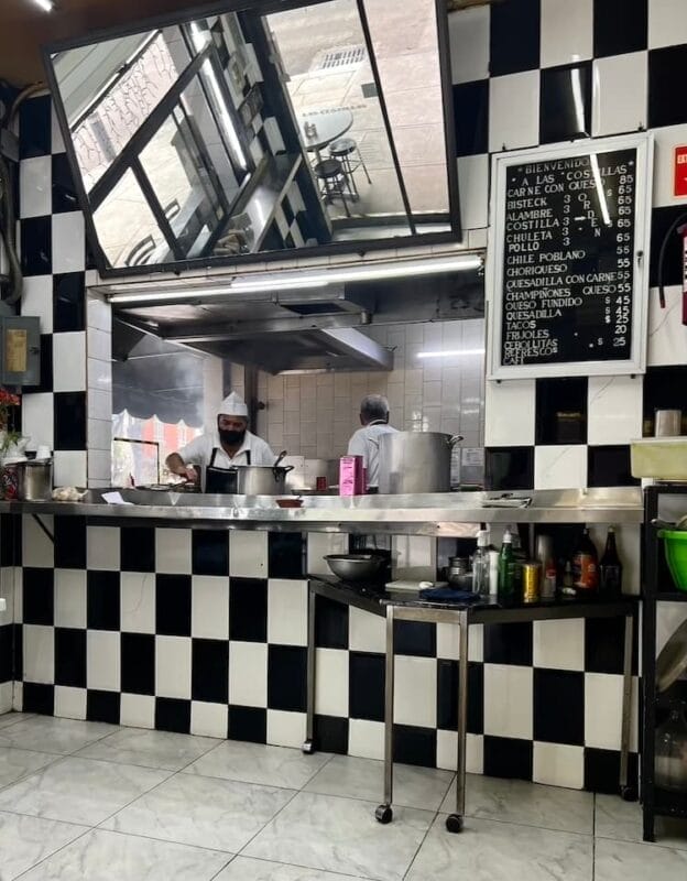 black and white diner style decor with open kitchen