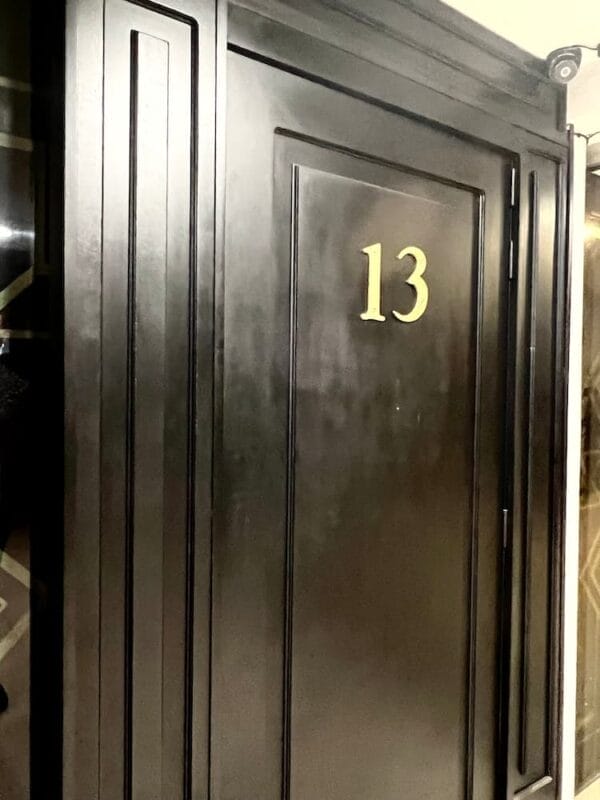 black door with the number 13 on it