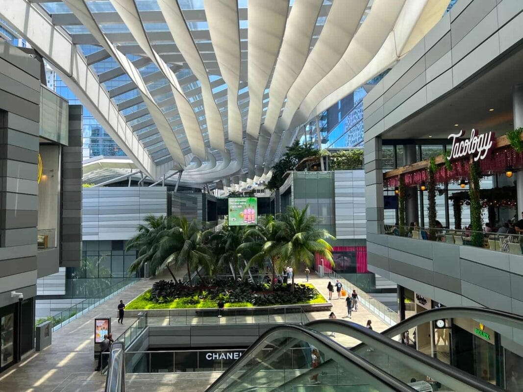 An urban open-air shopping mall with shops such as Chanel and restaurants