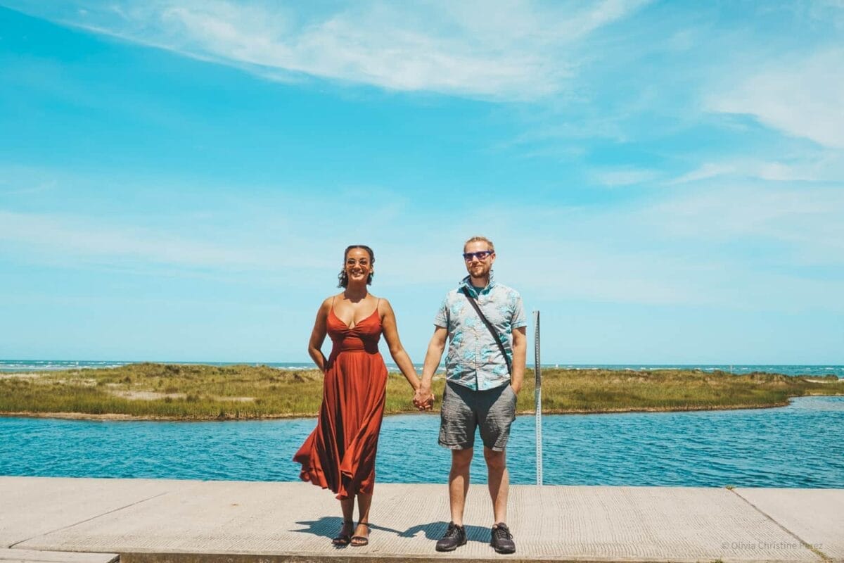 couple holding hands on the new jersey shore