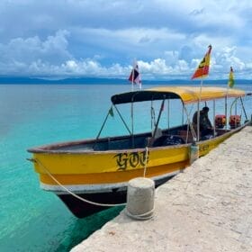 bright colored boat at dock in the caribbean sea