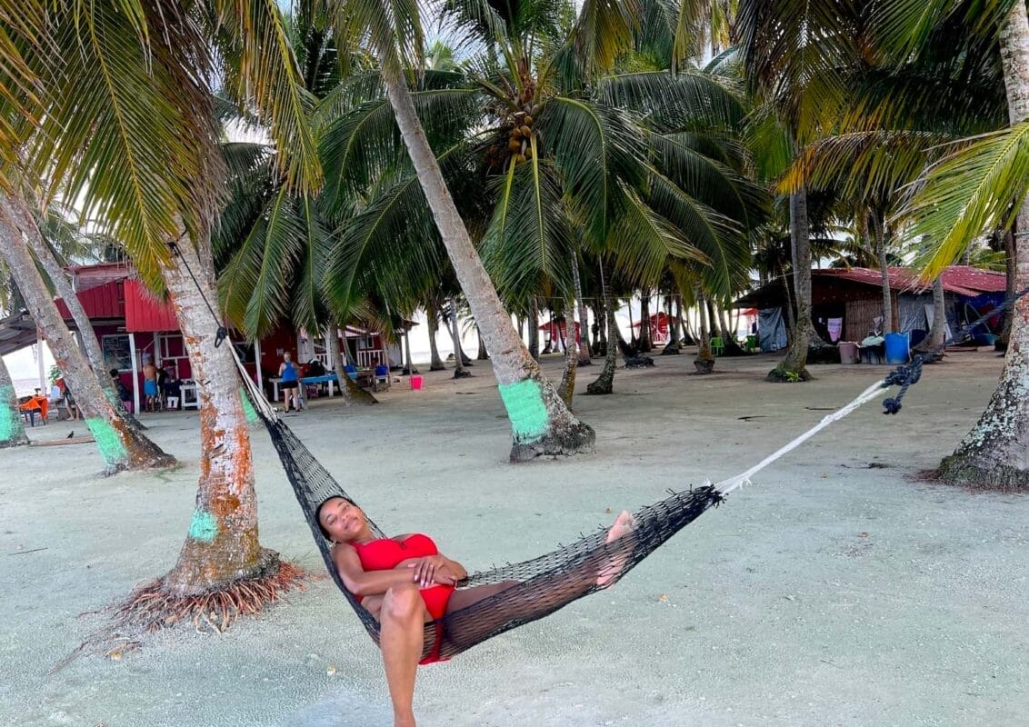 Tourists relaxing in hammock